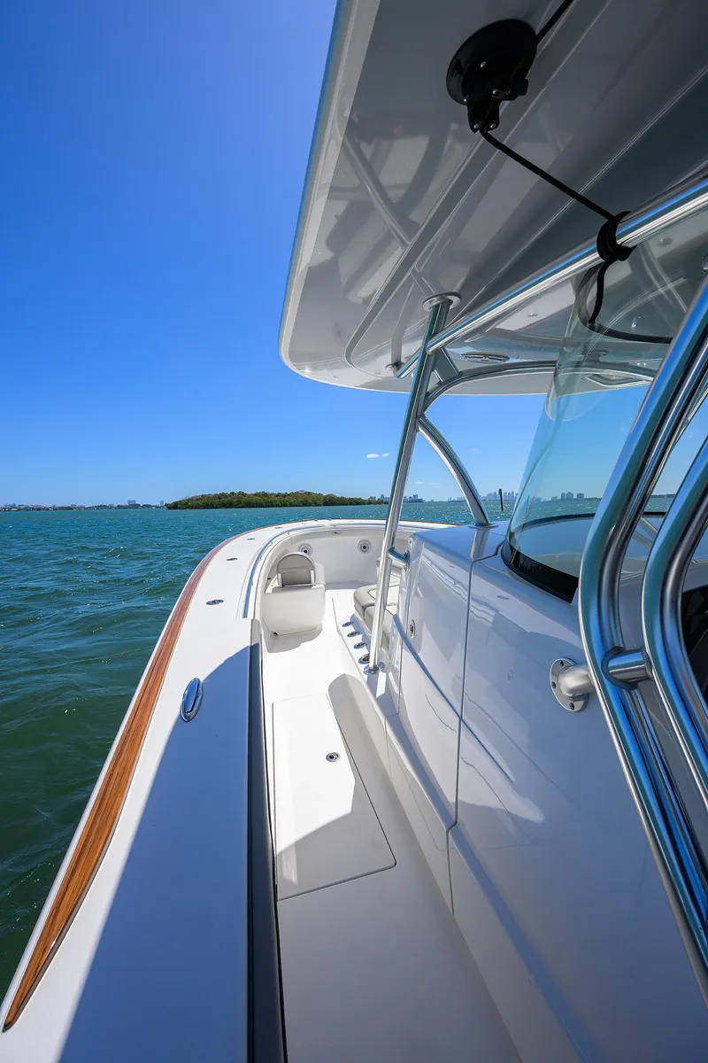 Slide: The Image of 2023 Valhalla Boatworks V-41 on water, sleek design, sunny day, blue sky. - 19