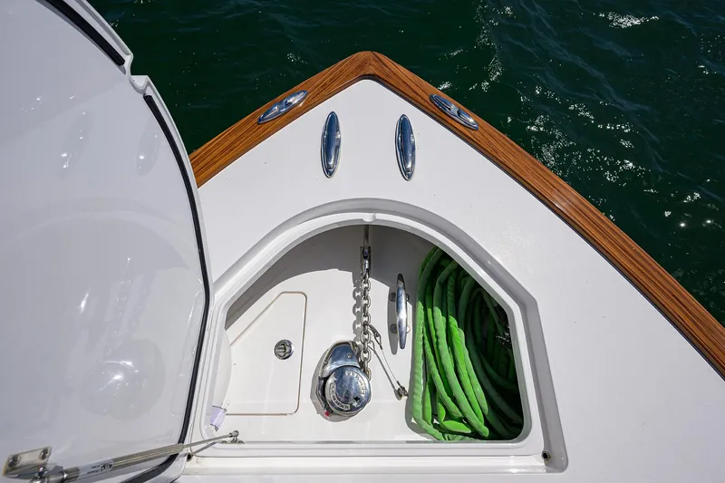 Slide: The Image of 2023 Valhalla Boatworks V-41 anchor locker with chain and green rope. - 23