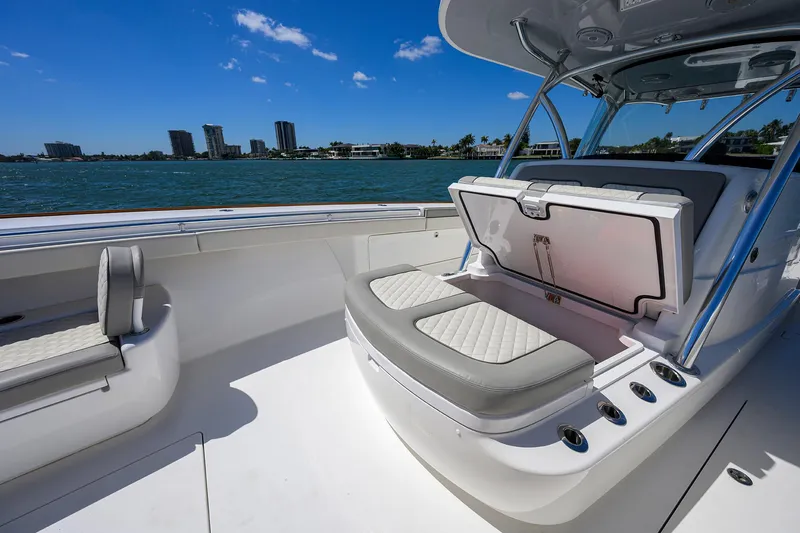 Slide: The Image of 2023 Valhalla Boatworks V-41 interior with seating, open water view, and city skyline. - 26