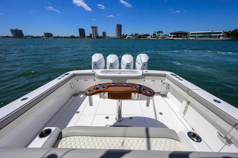 Slide: The Image of 2023 Valhalla Boatworks V-41 on water, featuring spacious deck and quad engines. - 32