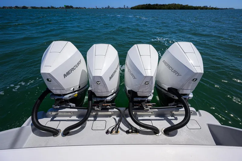 Slide: The Image of Four Mercury outboard engines on a 2023 Valhalla Boatworks V-41 in open water. - 34