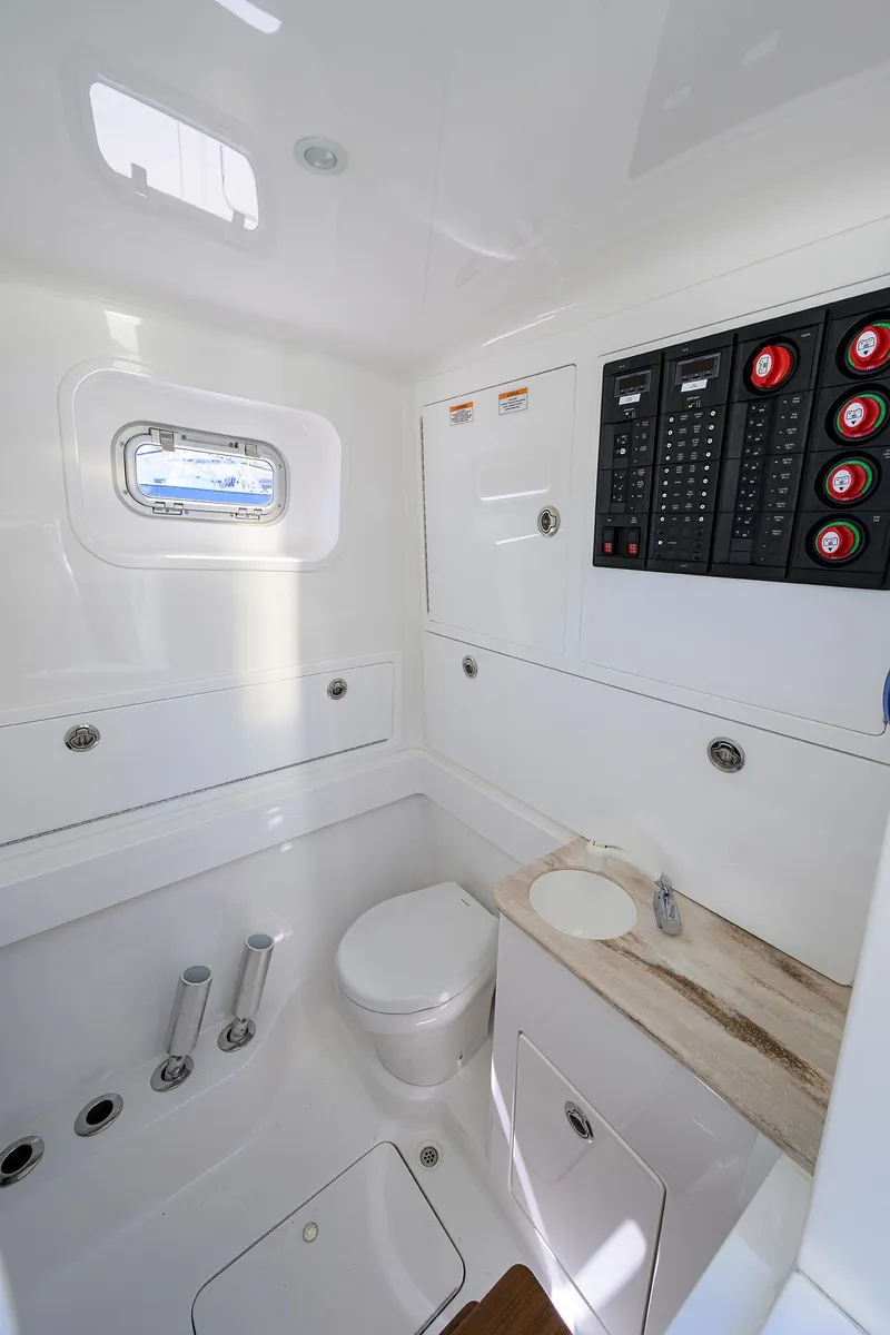 Slide: The Image of 2023 Valhalla V-41 boat interior with modern bathroom and control panel. - 36