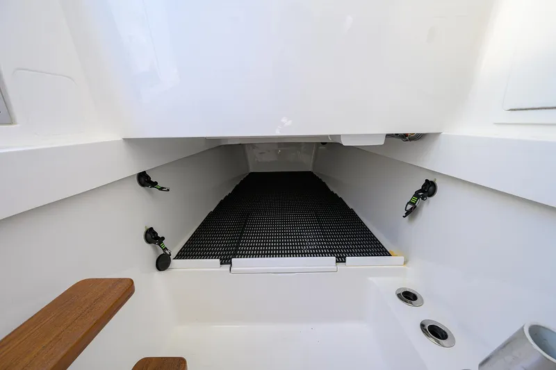 Slide: The Image of 2023 Valhalla Boatworks V-41 interior with storage area and wooden steps. - 40