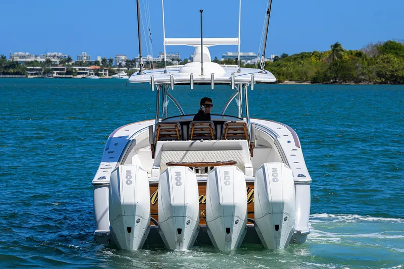 Slide: The Image of 2023 Valhalla Boatworks V-41 with quad engines cruising on blue water. - 7