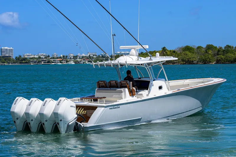 Slide: The Image of 2023 Valhalla Boatworks V-41 cruising on a sunny day with four outboard engines. - 8