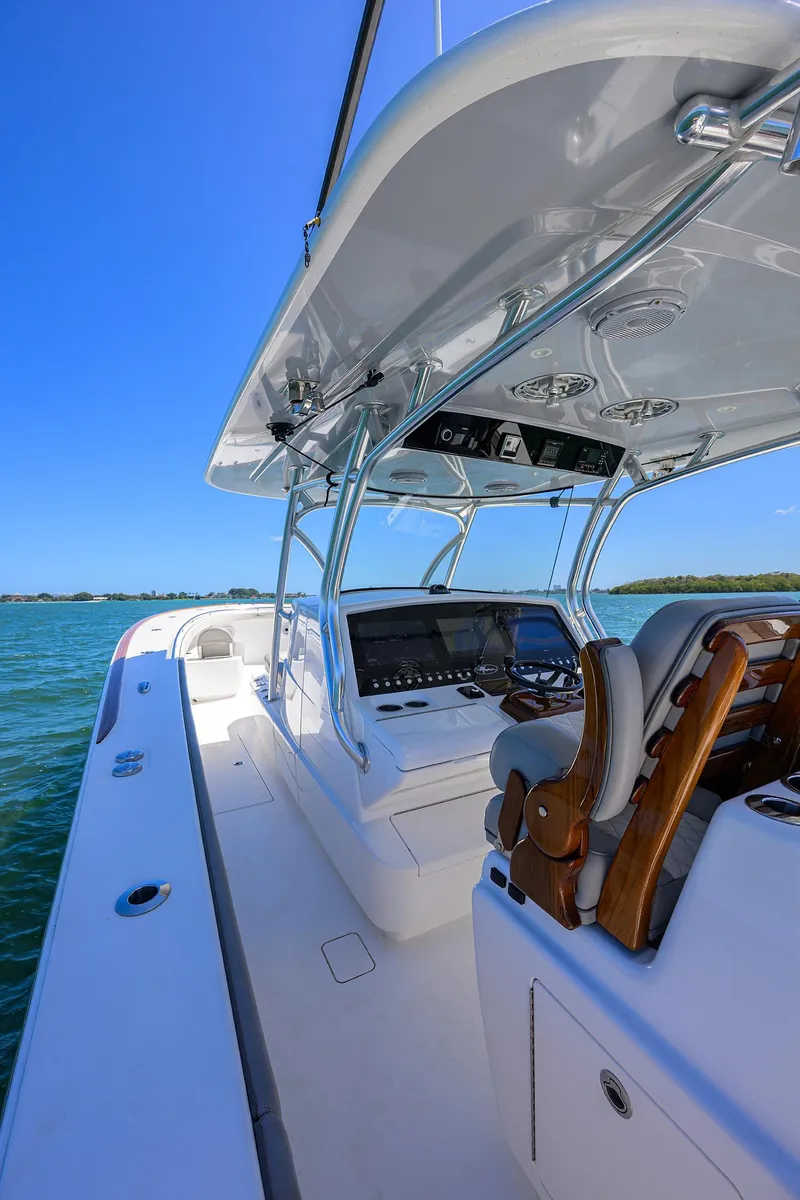 Slide: The Image of 2023 Valhalla Boatworks V-41, sleek design, open deck, advanced controls, ocean backdrop. - 9