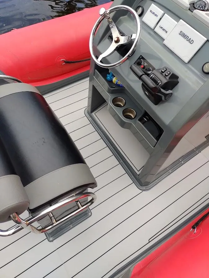 Slide: The Image of Inflatable Rigid boat interior with steering wheel and control panel, 2016 model. - 9