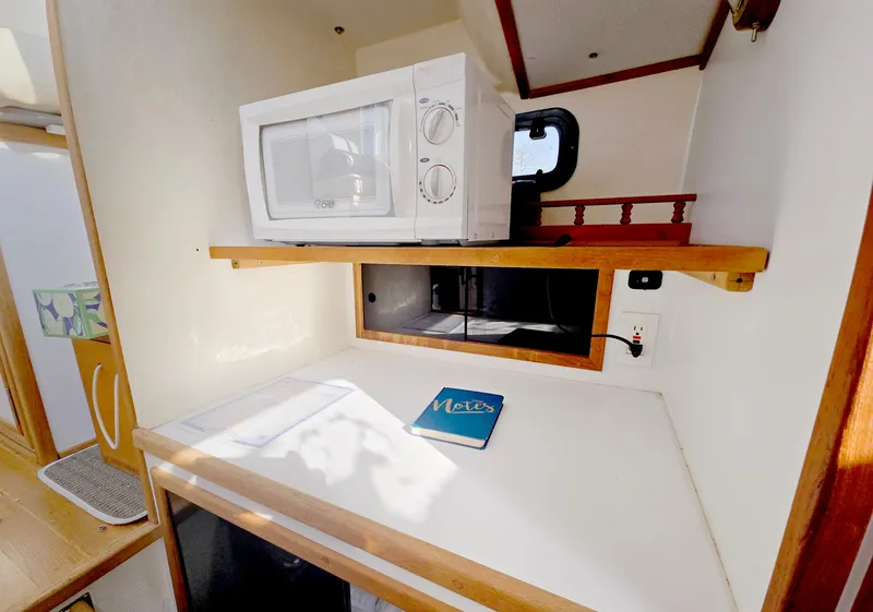 Slide: The Image of Interior of 2008 Eastern Casco Bay 31 with microwave and countertop. - 22