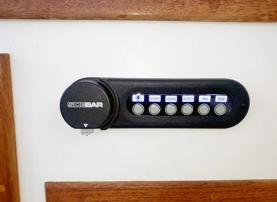 Slide: The Image of Sidebar beverage dispenser with labeled buttons for drinks on Eastern Casco Bay 31, 2008 model. - 26