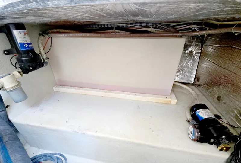 Slide: The Image of 2008 Eastern Casco Bay 31 boat interior with visible wiring and equipment. - 29