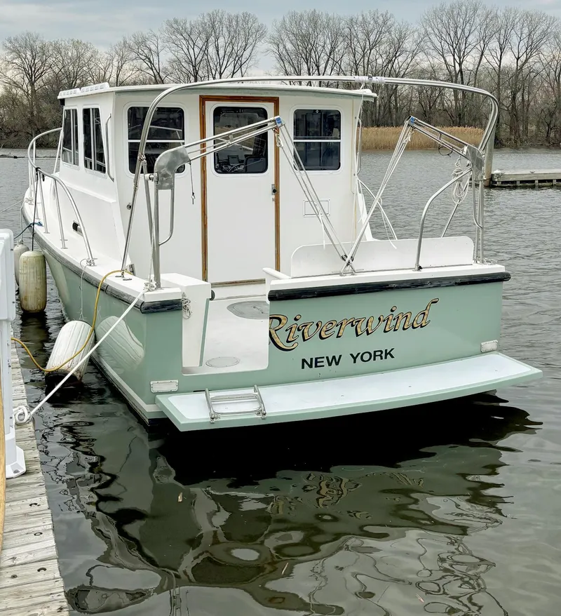 Slide: The Image of 2008 Eastern Casco Bay 31 boat named "Riverwind" docked in New York. - 3