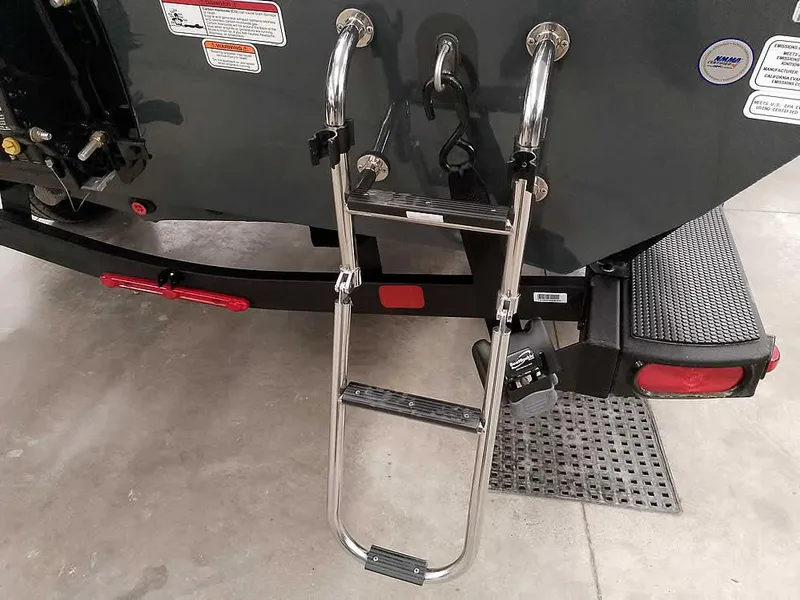 Slide: The Image of 2025 Ranger RT178 SC boat ladder and trailer detail in a garage setting. - 10