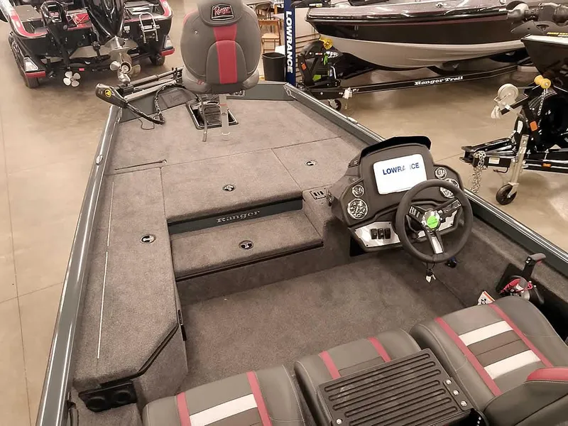 Slide: The Image of 2025 Ranger RT178 SC fishing boat interior with steering console and seating. - 11