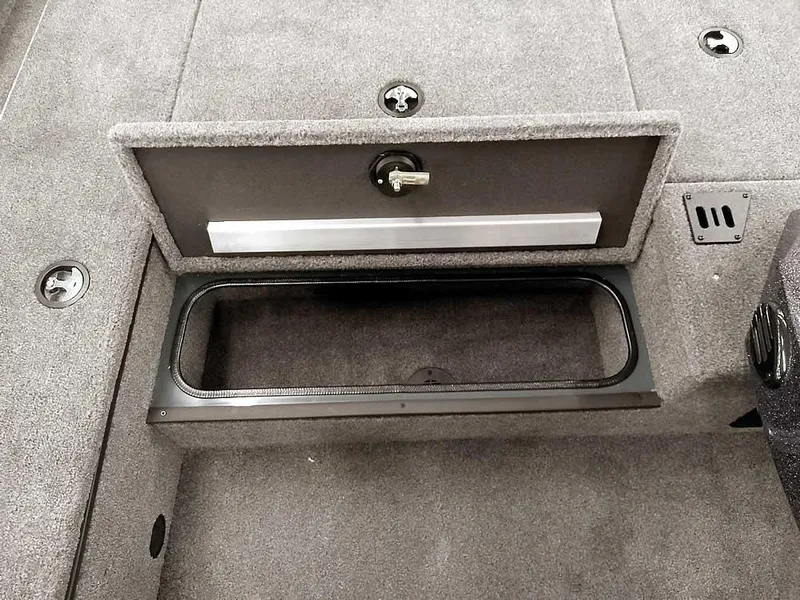 Slide: The Image of 2025 Ranger RT178 SC boat storage compartment with open lid, showcasing interior space. - 12