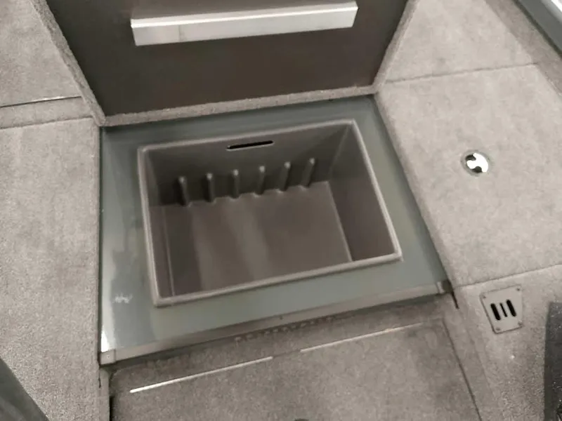 Slide: The Image of 2025 Ranger RT178 SC boat storage compartment with gray interior and secure latch. - 13