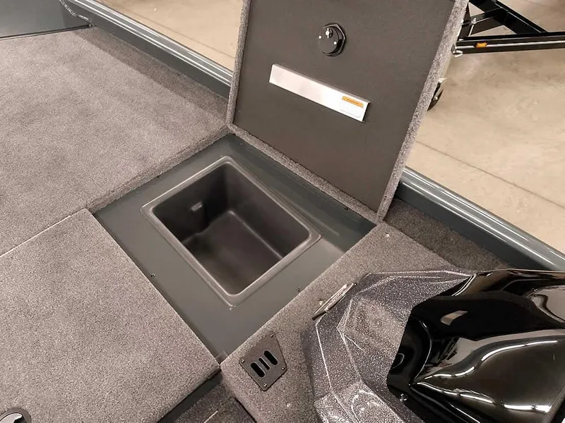 Slide: The Image of 2025 Ranger RT178 SC boat storage compartment with open lid, showcasing interior space. - 14