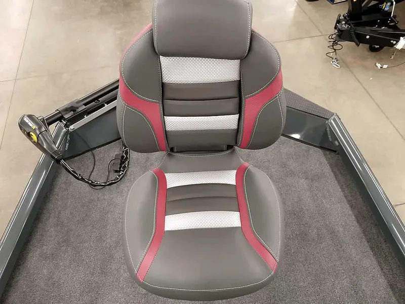 Slide: The Image of 2025 Ranger RT178 SC boat seat with gray and red accents on carpeted deck. - 16
