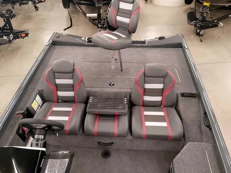 Slide: The Image of 2025 Ranger RT178 SC boat interior with gray and red seats, featuring a central console. - 19