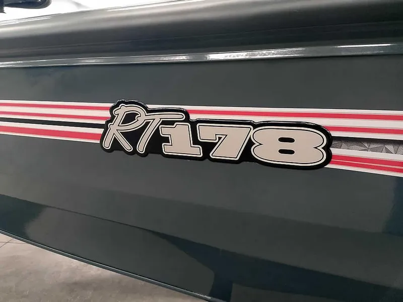Slide: The Image of 2025 Ranger RT178 SC boat with red and white stripes on the side. - 2