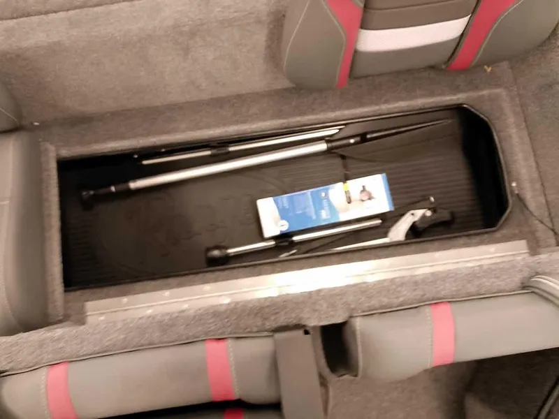 Slide: The Image of 2025 Ranger RT178 SC boat storage compartment with fishing gear and accessories. - 21