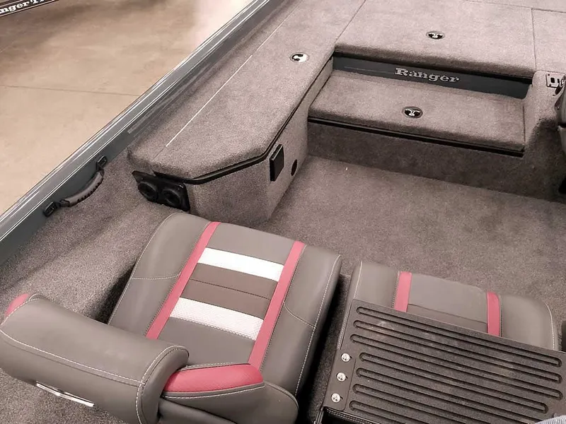 Slide: The Image of 2025 Ranger RT178 SC boat interior with gray and red seating, carpeted flooring, and storage compartments. - 22
