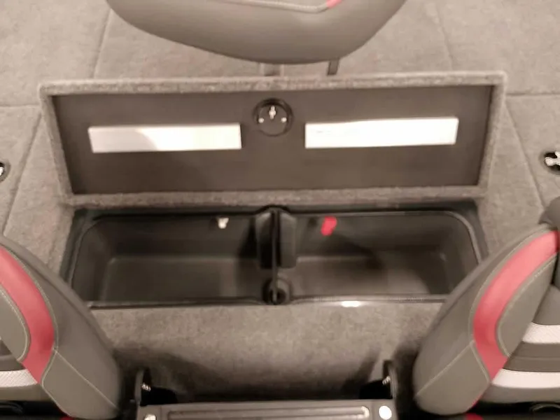 Slide: The Image of 2025 Ranger RT178 SC boat interior storage compartment with open lid, showcasing seating and carpeted flooring. - 27