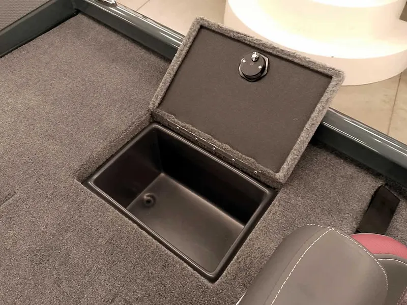 Slide: The Image of 2025 Ranger RT178 SC boat storage compartment with open lid, showcasing interior space. - 28