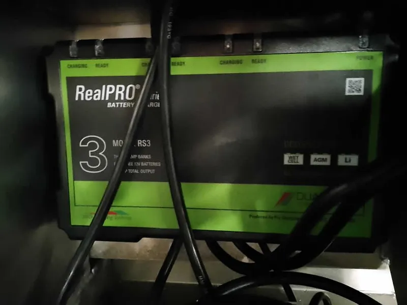 Slide: The Image of RealPRO RS3 battery charger in a 2025 Ranger RT178 SC boat. - 31