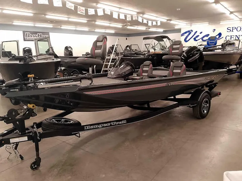 Slide: The Image of 2025 Ranger RT178 SC boat displayed in showroom with other boats. - 35