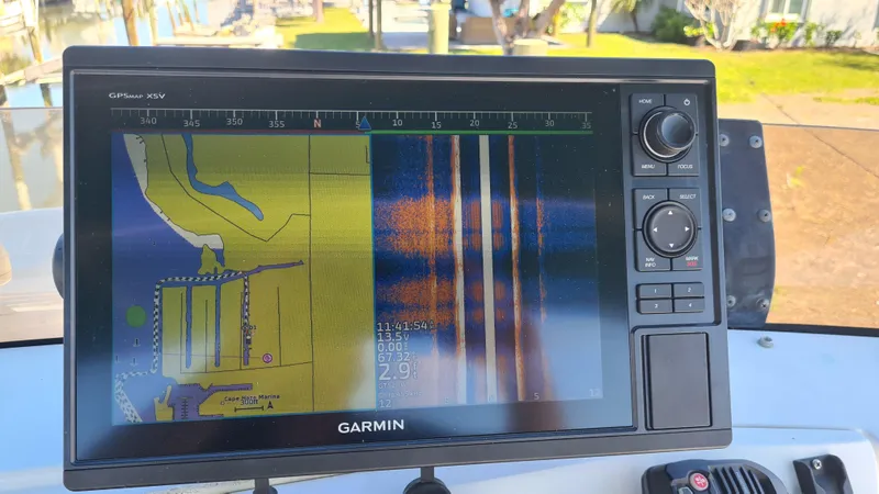 Slide: The Image of Garmin GPS display on 1999 Mainship 350 Trawler, showing navigation and sonar data. - 11
