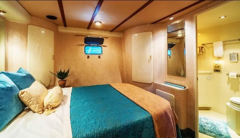 Slide: The Image of Luxurious cabin interior of 1994 Shaw 57 yacht with cozy bed and ensuite bathroom. - 14