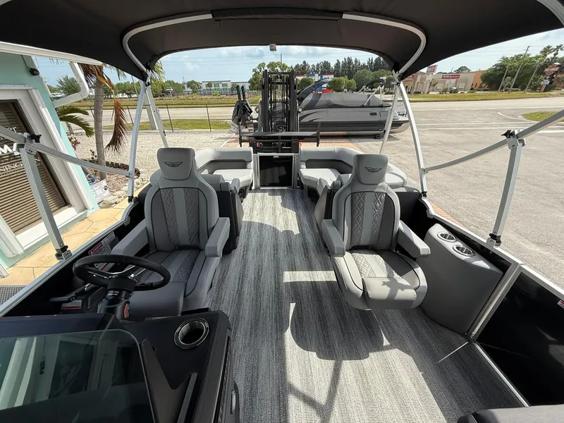 Slide: The Image of 2025 Bennington 22 MFB pontoon boat interior with plush seating and modern design. - 11