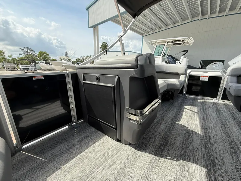 Slide: The Image of 2025 Bennington 22 MFB pontoon boat interior with modern seating and carpeted flooring. - 13