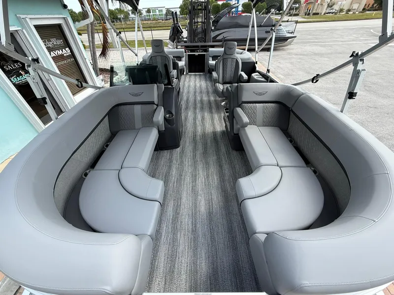 Slide: The Image of 2025 Bennington 22 MFB pontoon boat with spacious gray seating and modern design. - 18