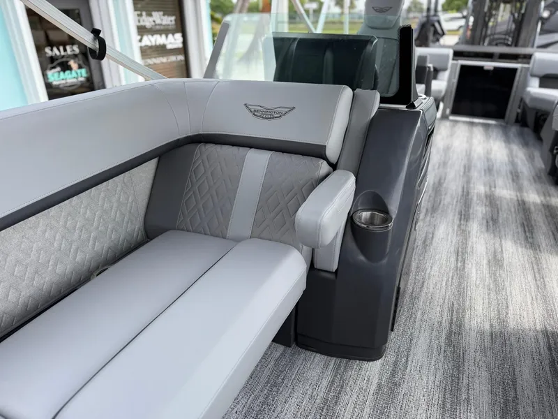 Slide: The Image of 2025 Bennington 22 MFB boat interior with gray seating and modern design. - 19