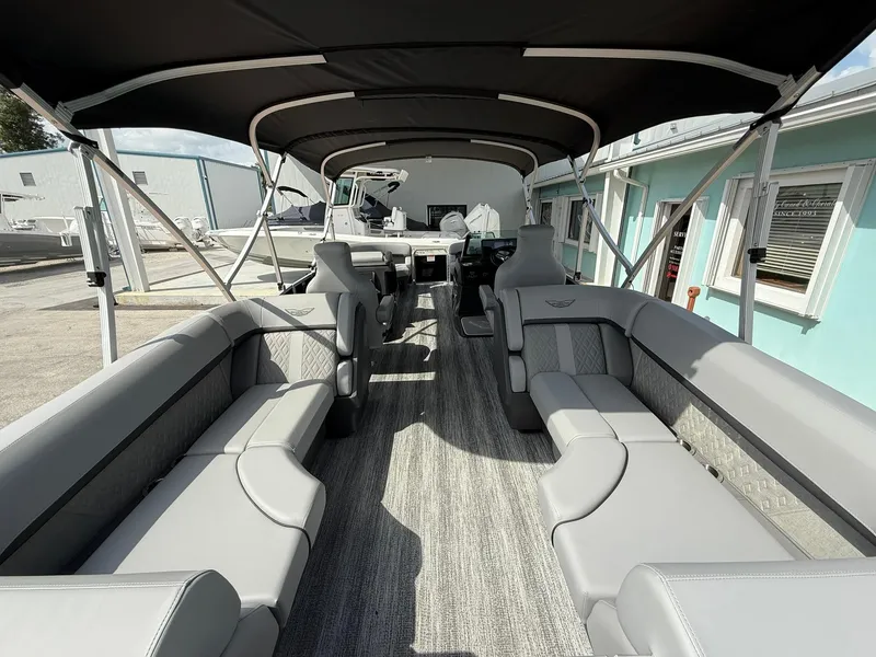 Slide: The Image of 2025 Bennington 22 MFB pontoon boat interior with spacious seating and canopy. - 5