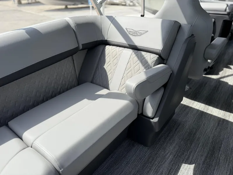 Slide: The Image of Luxurious seating in the 2025 Bennington 22 MFB boat, featuring elegant gray upholstery. - 6