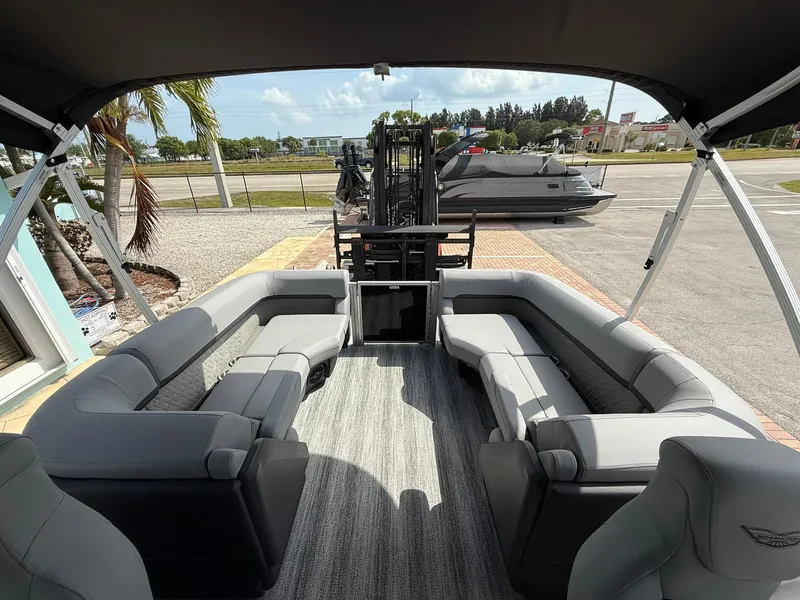 Slide: The Image of 2025 Bennington 22 MFB pontoon boat interior with gray seating and canopy. - 7