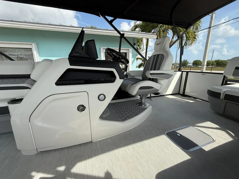 Slide: The Image of 2025 Bennington 26 MSB boat interior with modern helm and seating. - 10