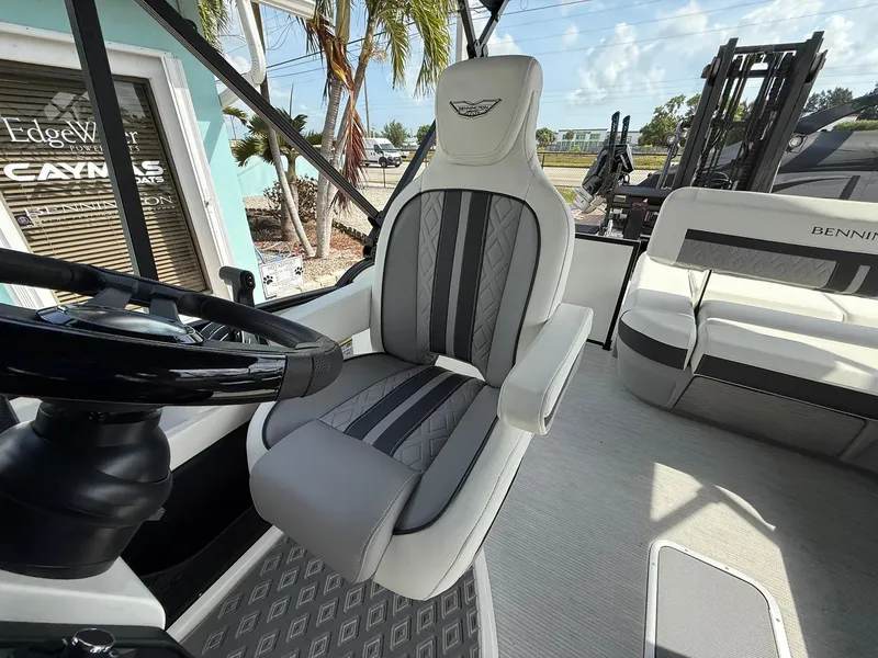 Slide: The Image of Captain's chair on 2025 Bennington 26 MSB boat, featuring sleek design and modern upholstery. - 11