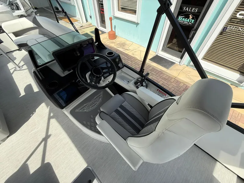 Slide: The Image of 2025 Bennington 26 MSB boat helm with modern steering and comfortable seating. - 12