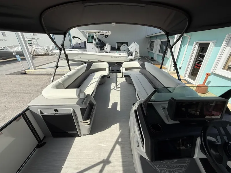 Slide: The Image of 2025 Bennington 26 MSB pontoon boat interior with spacious seating and modern design. - 14