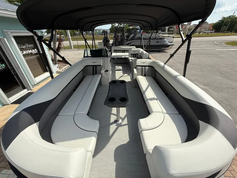 Slide: The Image of 2025 Bennington 26 MSB pontoon boat with spacious seating and canopy. - 19
