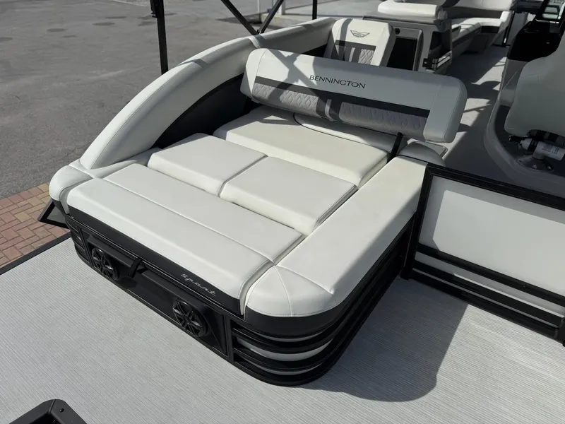 Slide: The Image of 2025 Bennington 26 MSB boat with luxurious white seating and sleek design. - 5