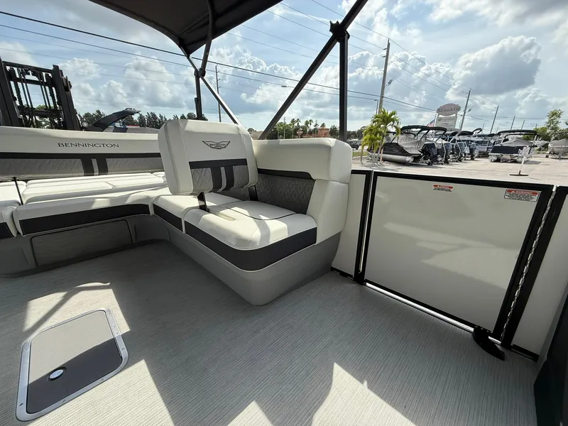 Slide: The Image of 2025 Bennington 26 MSB boat interior with plush seating and modern design. - 9