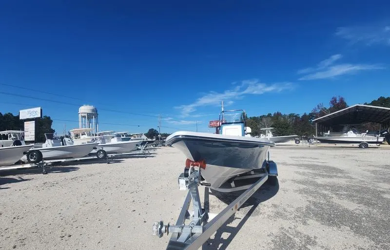 Slide: The Image of 2025 Blazer Bay 2200 boat on trailer in sunny outdoor lot. - 3