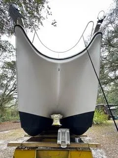 Slide: The Image of 2004 Baha Cruisers 290 King Kat boat hull on trailer, viewed from the front. - 14