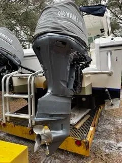 Slide: The Image of 2004 Baha Cruisers 290 King Kat with Yamaha outboard motor on trailer. - 16