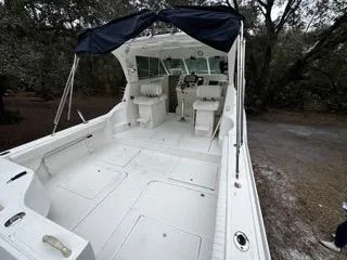 Slide: The Image of 2004 Baha Cruisers 290 King Kat boat with spacious deck and seating area. - 17