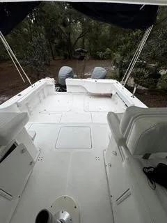 Slide: The Image of 2004 Baha Cruisers 290 King Kat boat interior with seating and twin engines. - 21